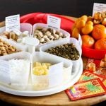 A guide to making your own Chinese New Year Candy Box (Tray of Togetherness) and the significance of each treat placed in there. | MalaysianChineseKitchen.com